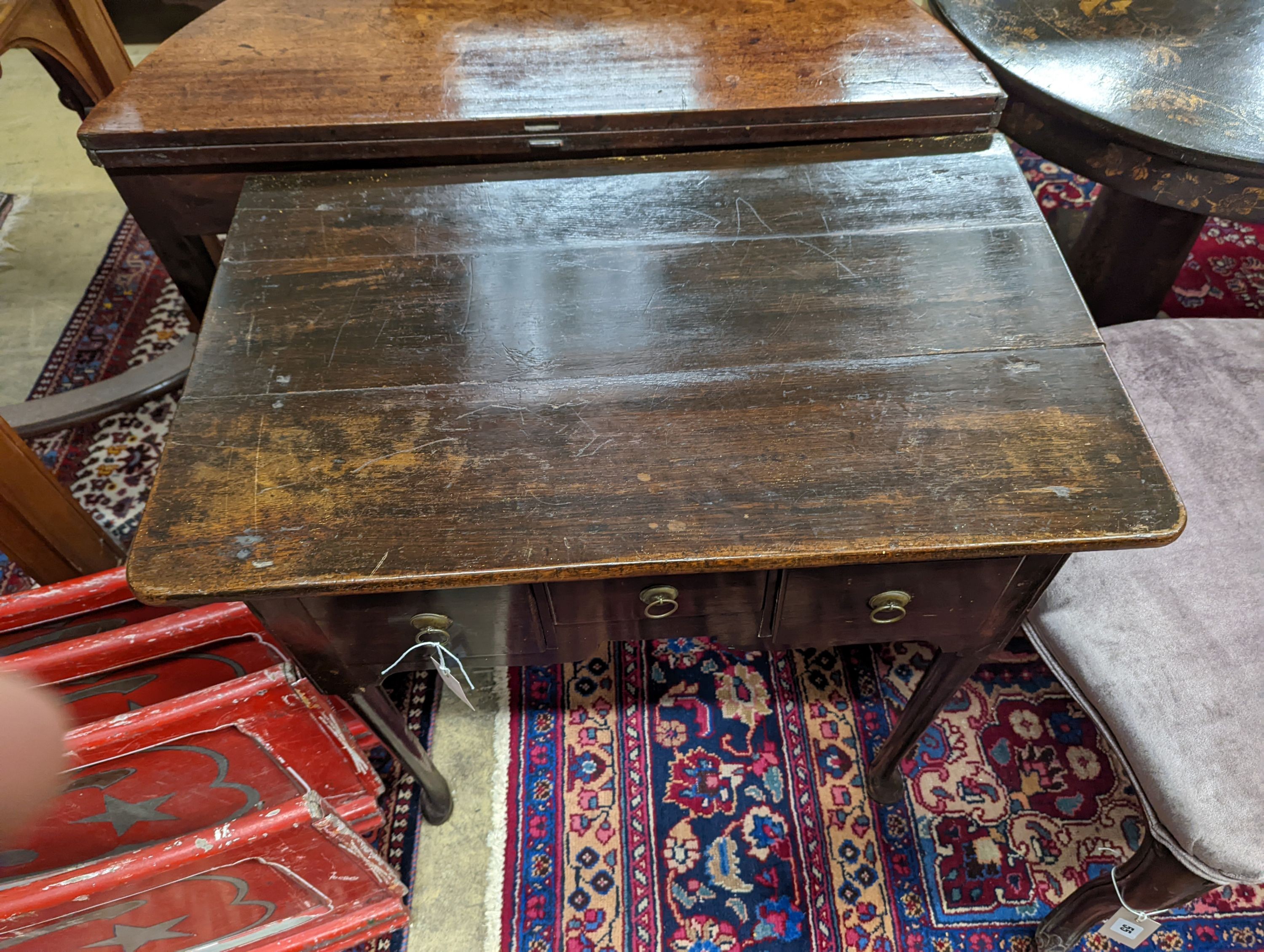 A mid 18th century oak lowboy. W-75, D-47, H-69cm.